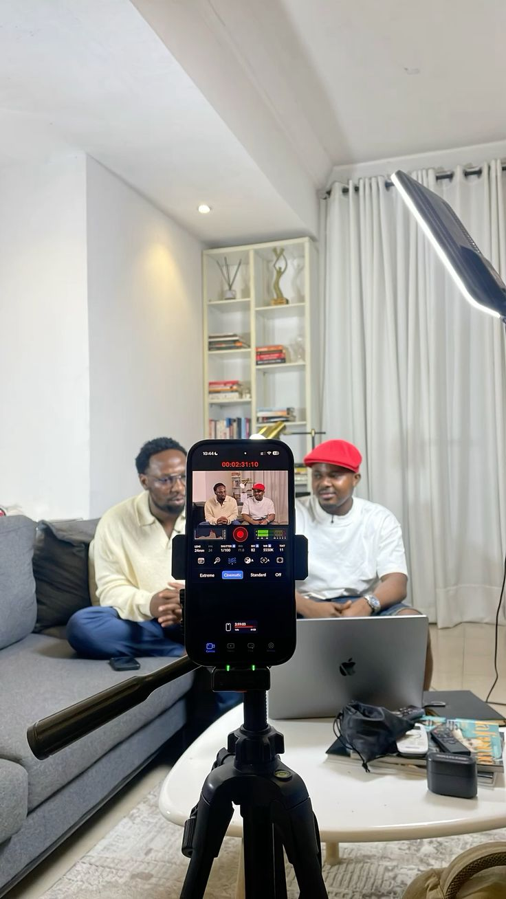 Creator workflow: phone on tripod with storyboard notebook
